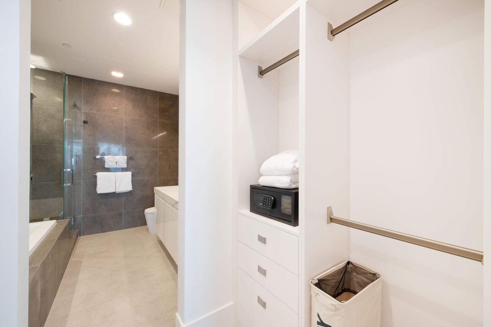 Walk-thru closet with deposit safe.