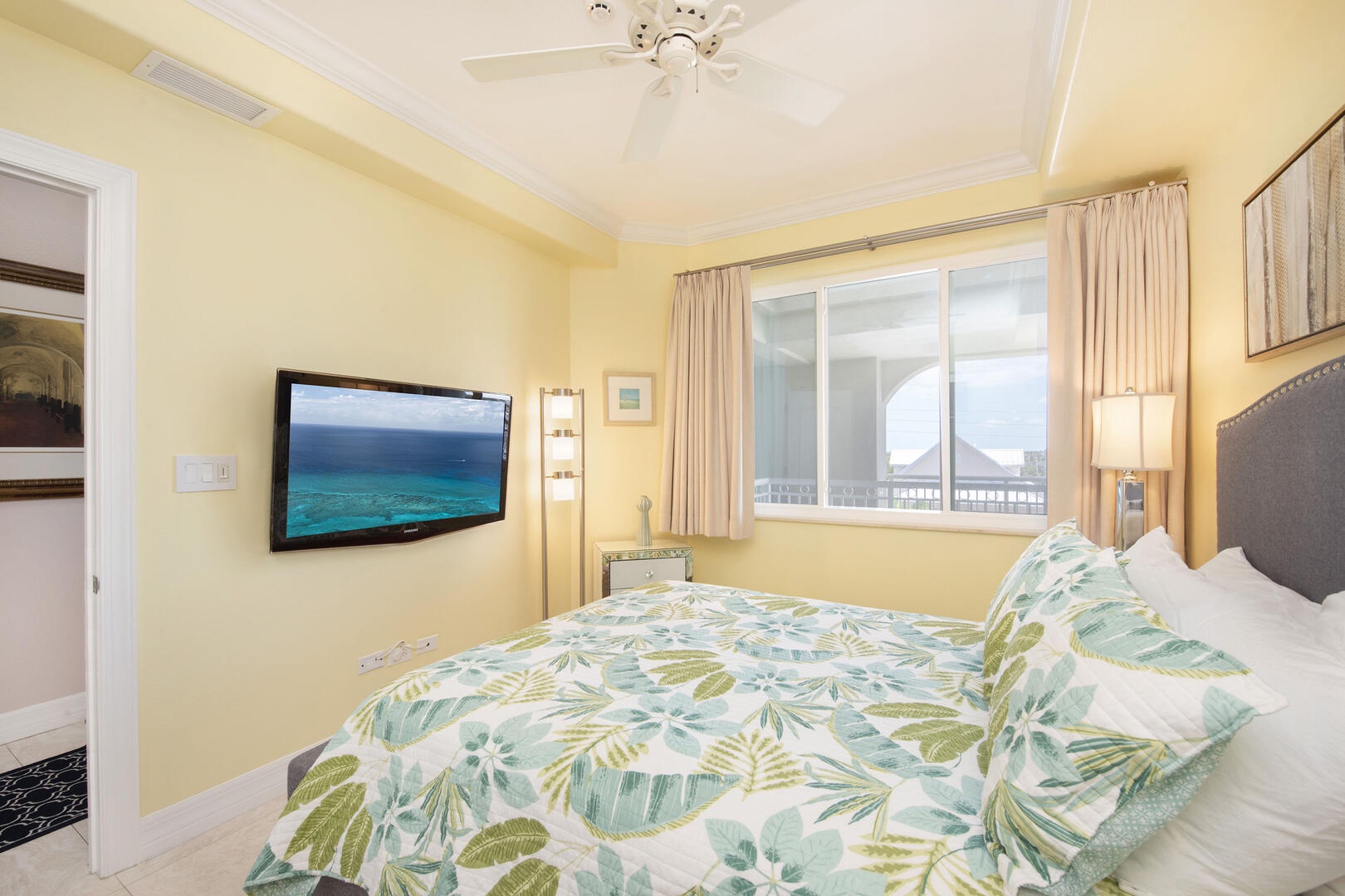 Guest Suite #2 with queen bed and television.