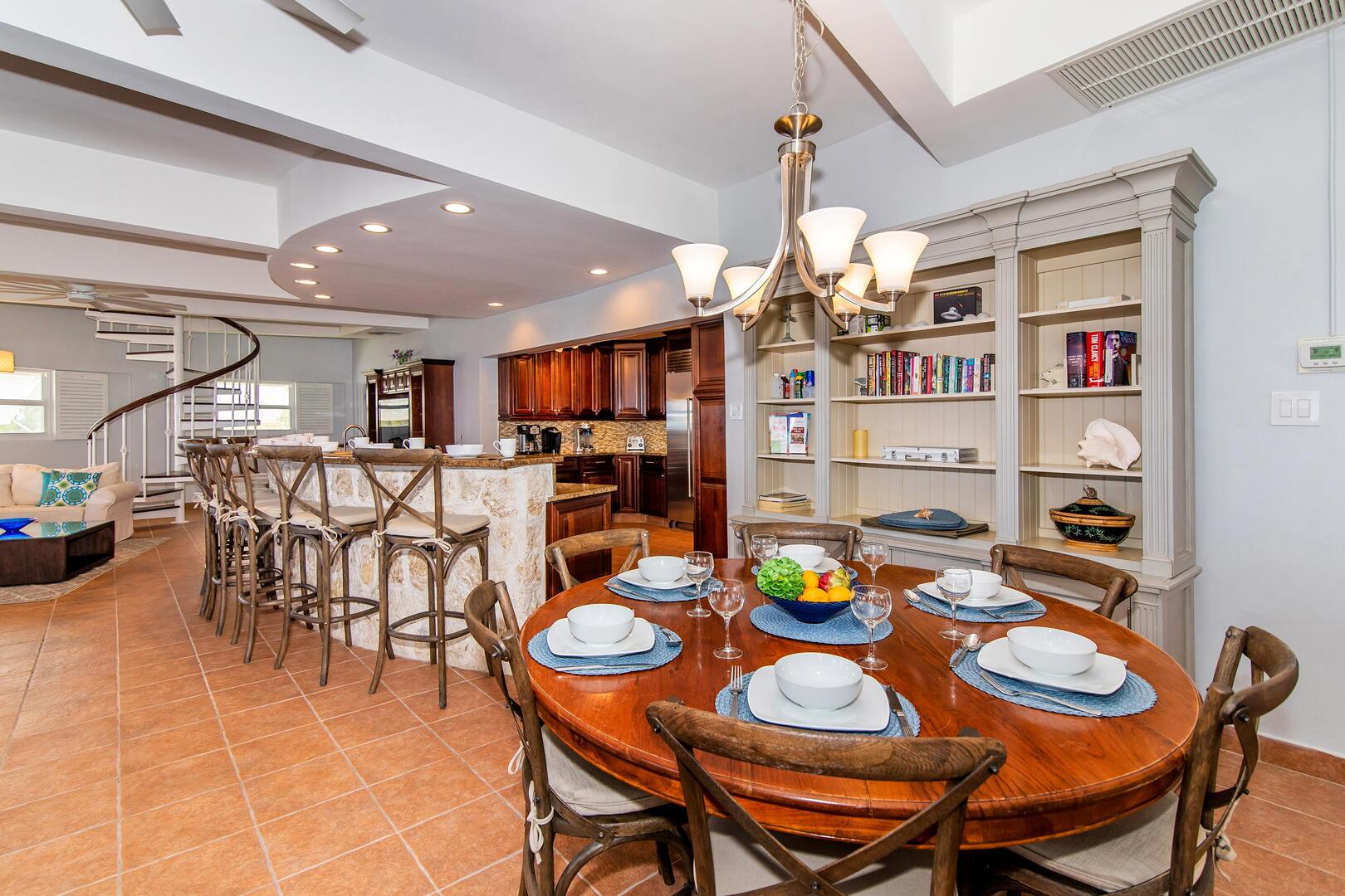 Small dining table in the great room seats 6 with overflow seating at the breakfast bar.