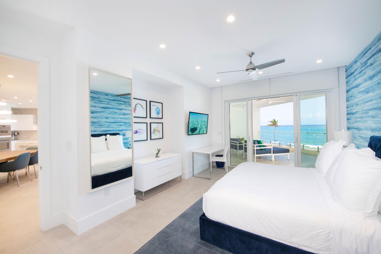 Primary Suite with king bed, SmartTV, and walk-out access to the balcony.