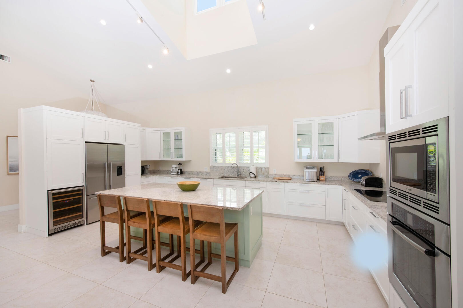 Kitchen with island seating for four plus a new wine fridge.