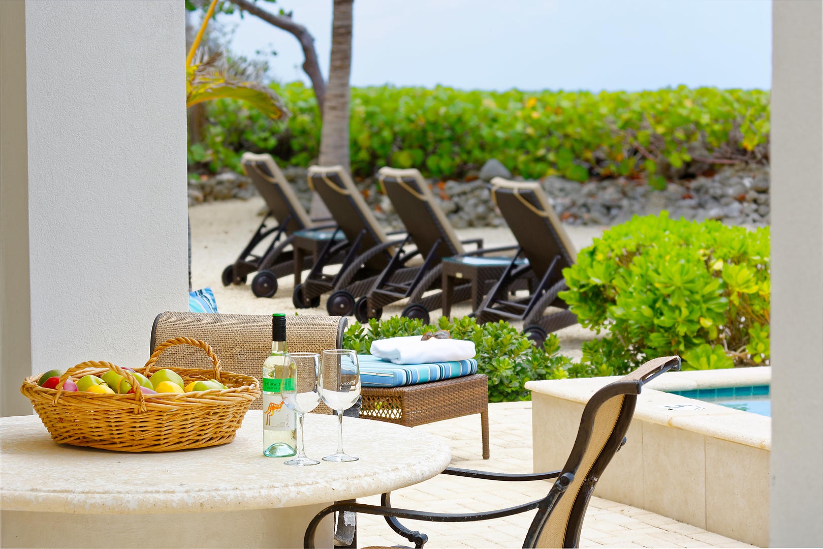 Small poolside table for wine or coffee.