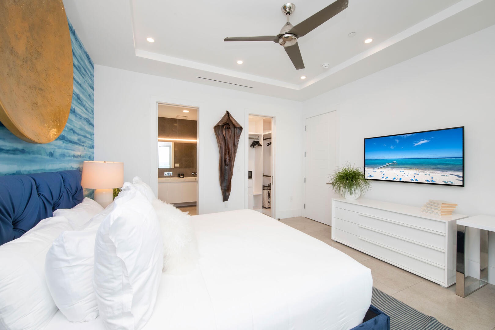 Primary suite with walk-in closet and ensuite in the background.