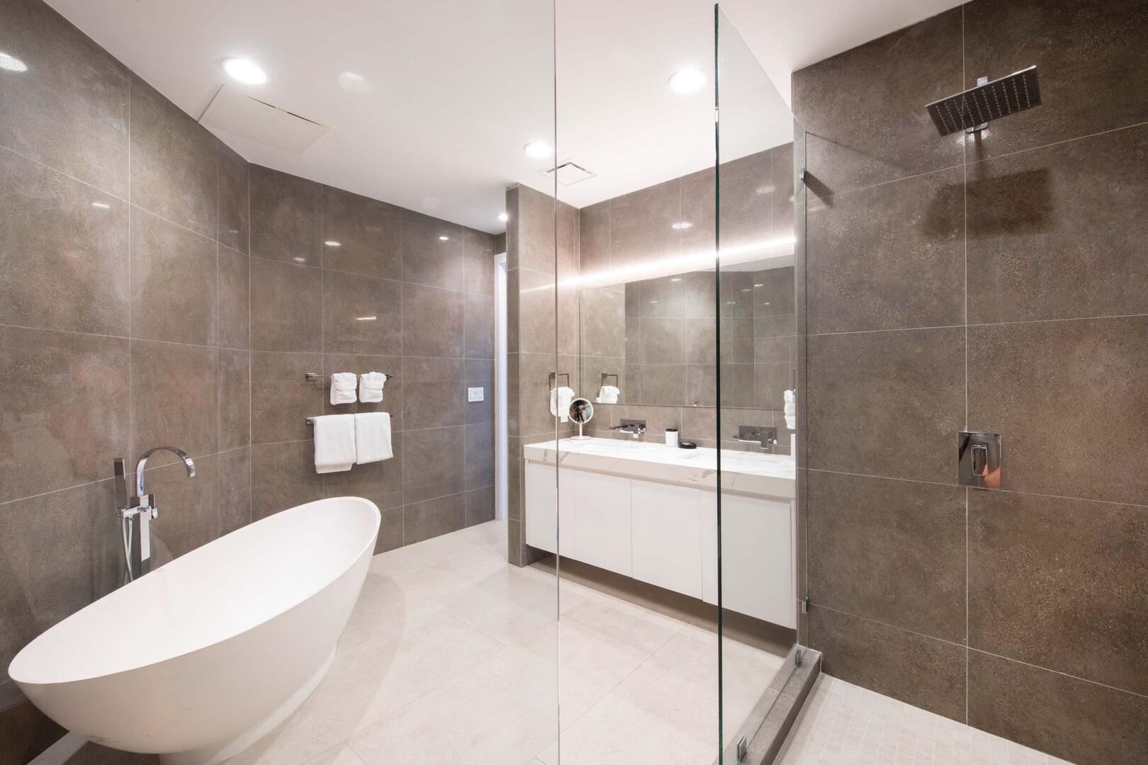 Primary Ensuite with soaking tub and frameless shower.