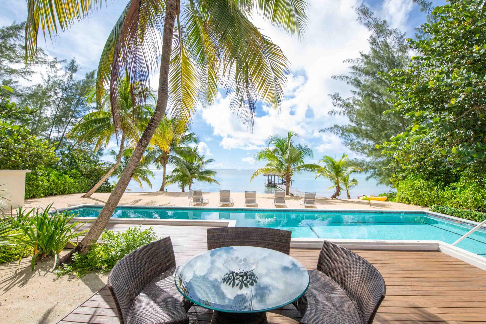 Alfresco dining table along the pool deck.