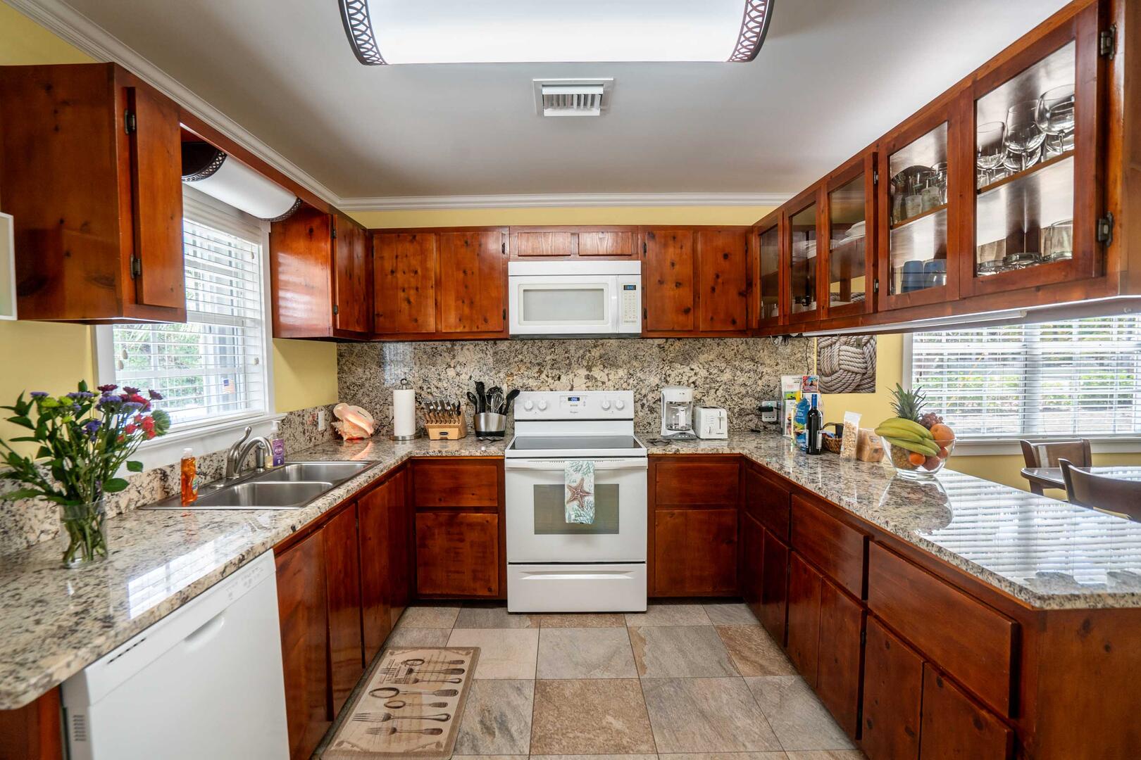 Full kitchen with modern appliances.