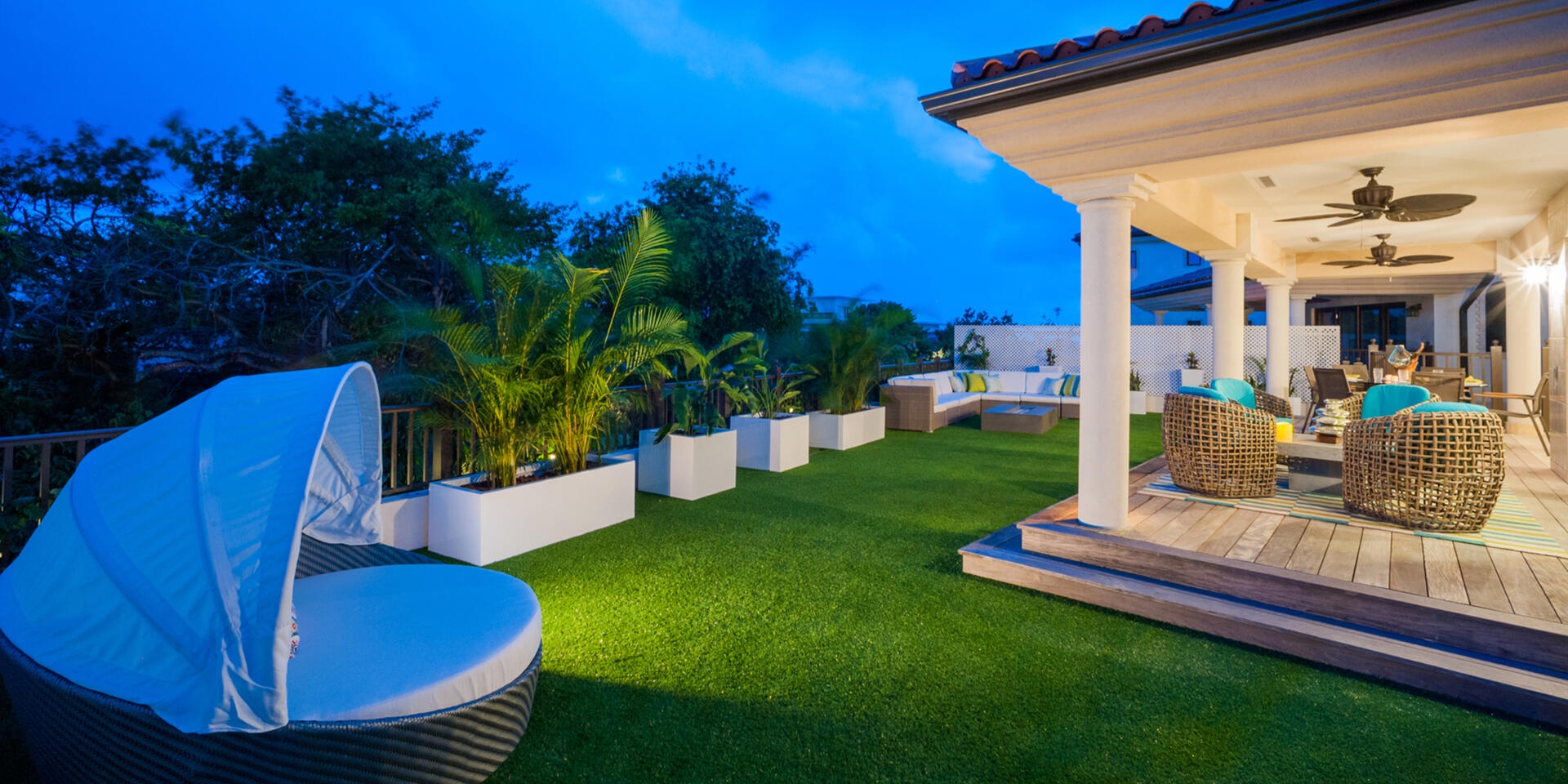 Backyard daybed with canopy for shade.