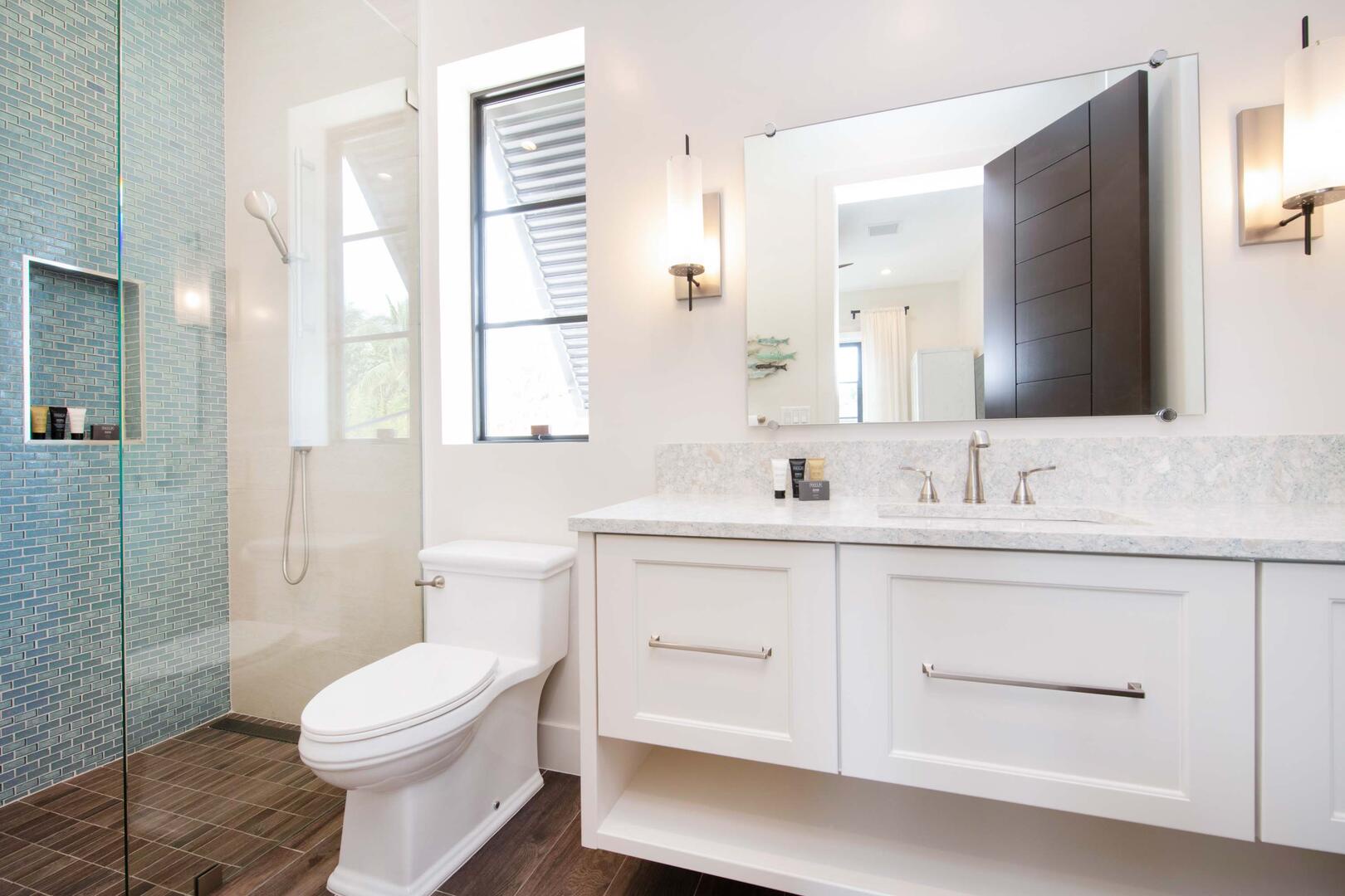 Twin Suite ensuite bath with double vanity, and walk-in shower.