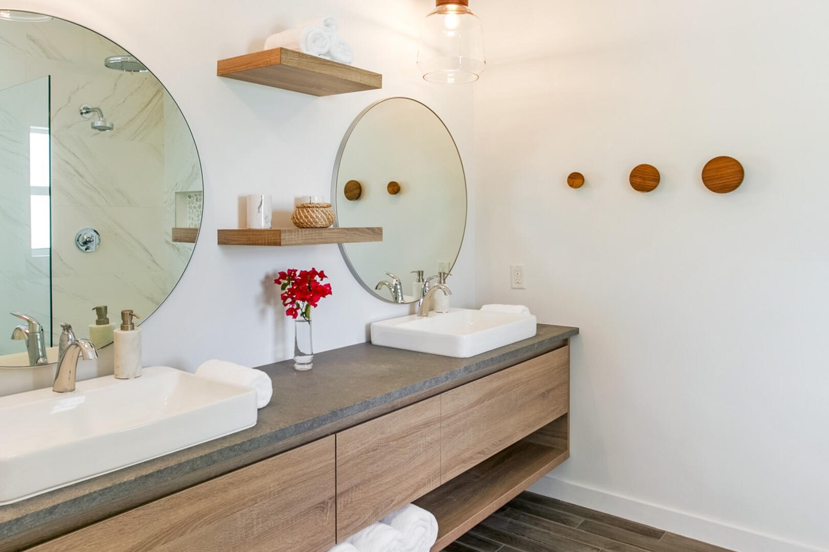 Primary ensuite with dual vanity and shower with rainfall water head.