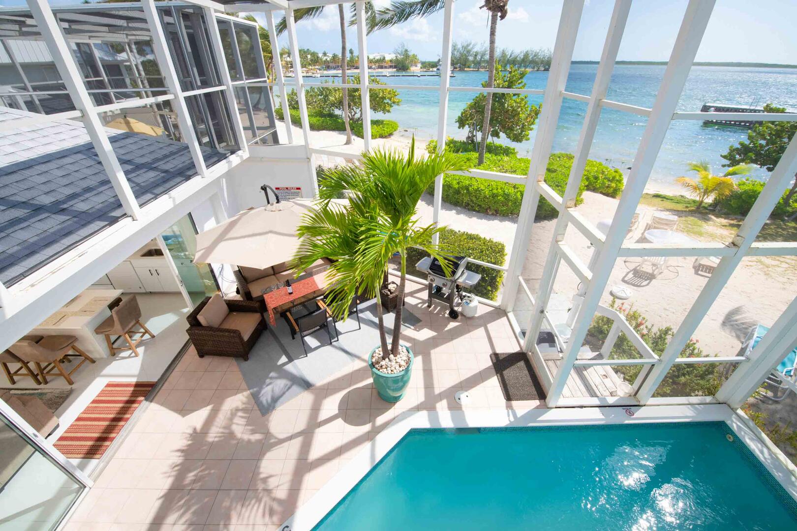 Balcony views of the beach and pool deck below.