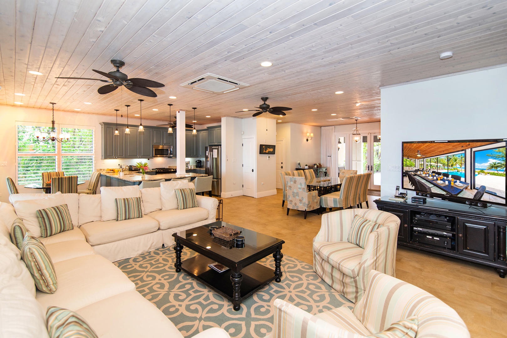 Open concept living area with entertainment console.