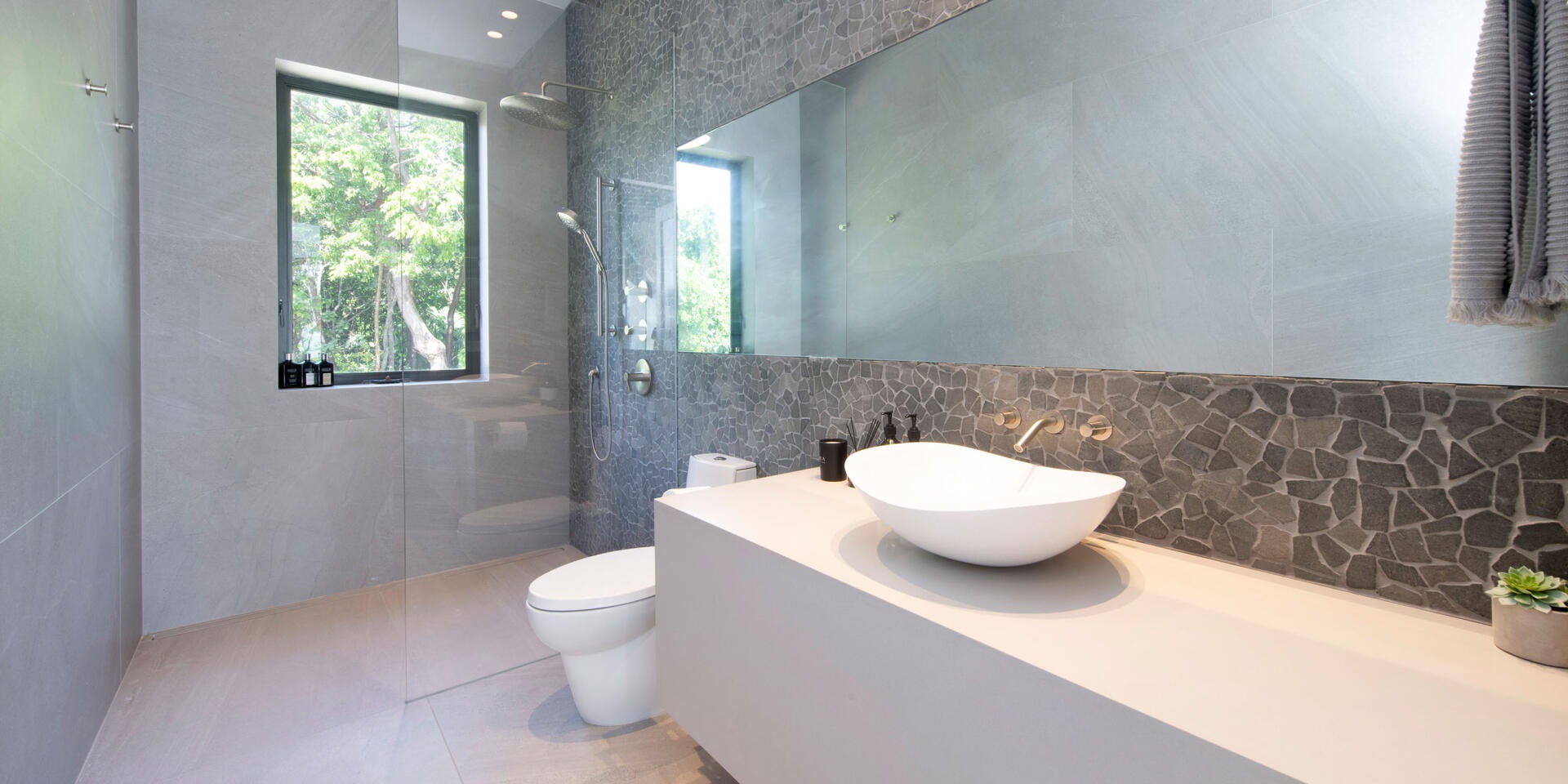 Full bathroom with shower off the pool deck.