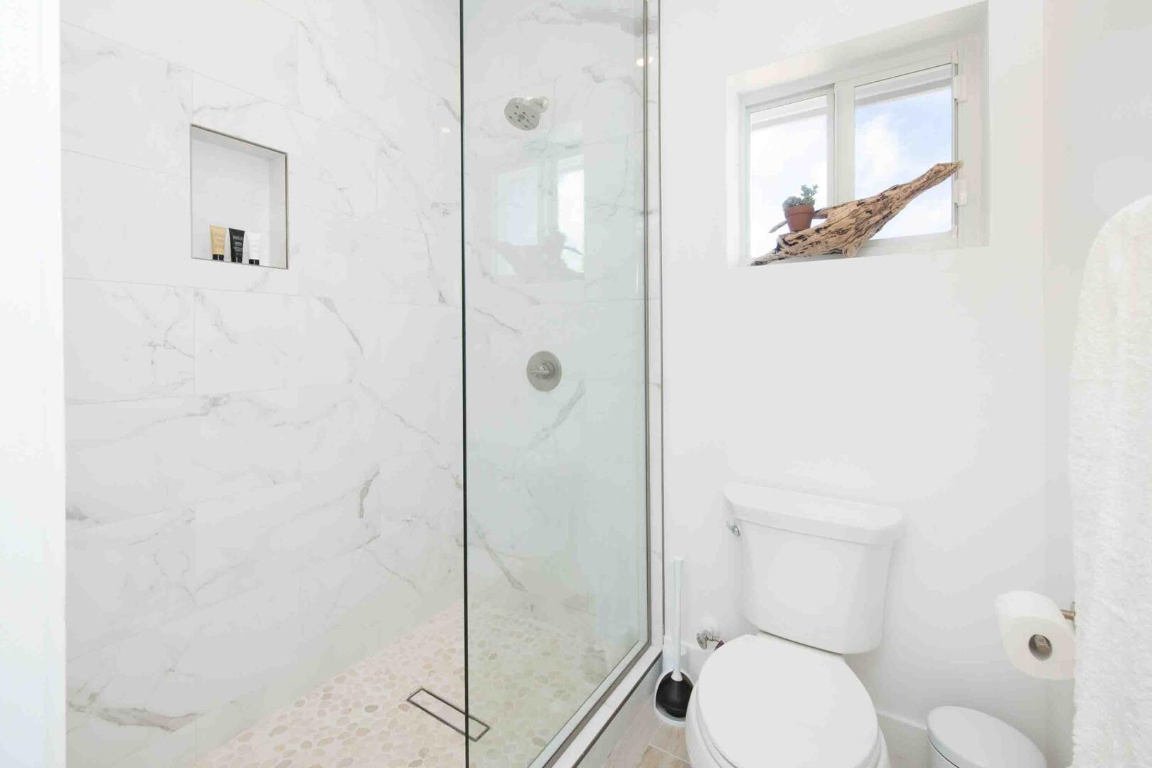 Shower and toilet in the Jack & Jill bathroom.