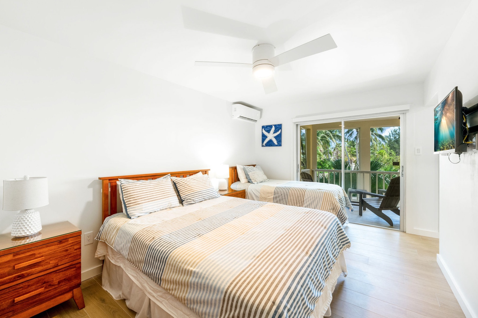 Bedroom 2 with queen and twin beds, plus an HD TV.