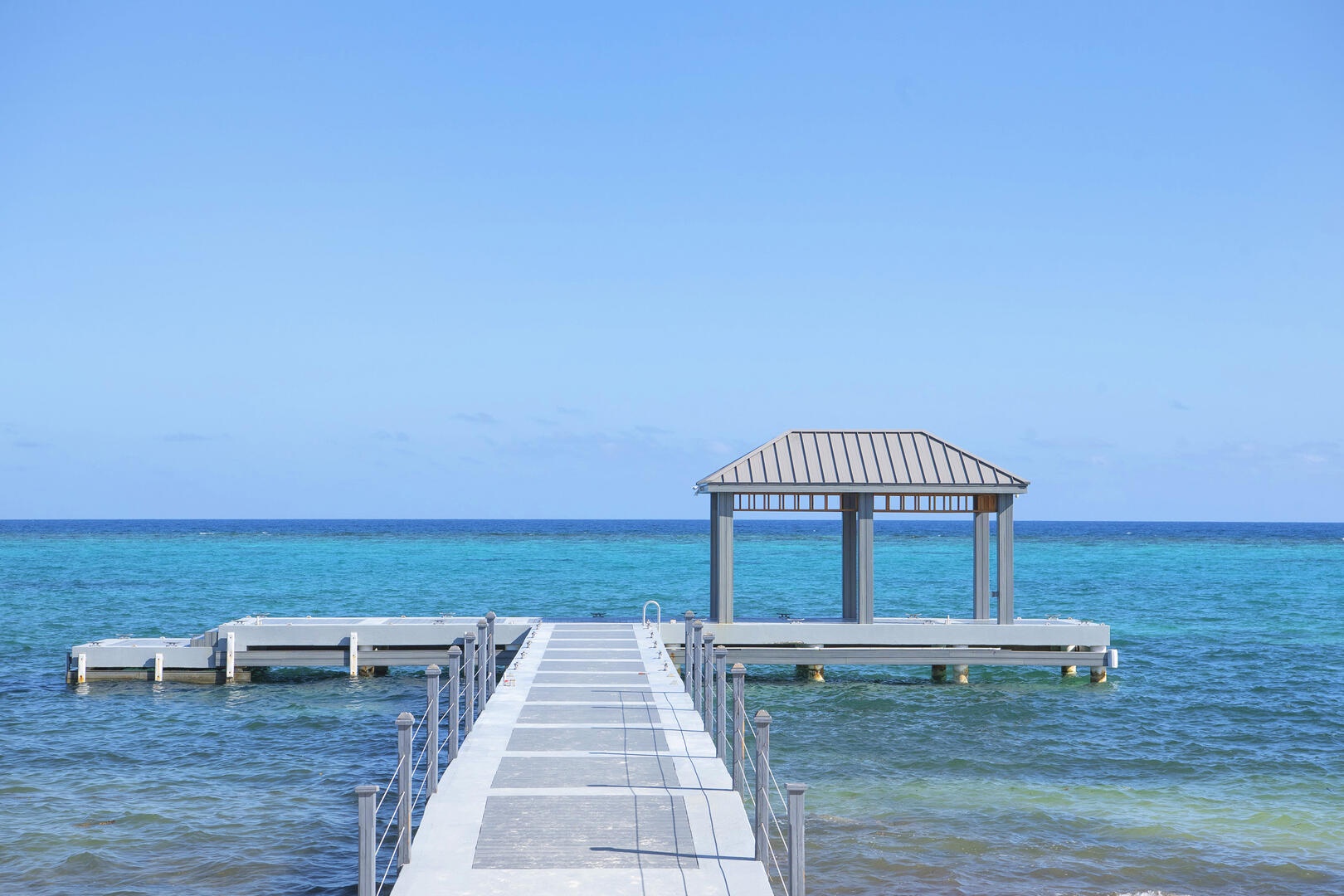 The resort's dock includes a cabana and ladder for gentle water entry for snorkeling.
