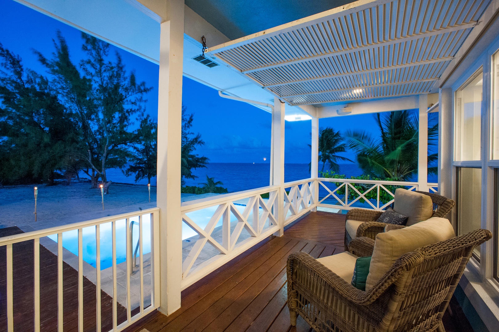 The screened porch has amazing views and is the post-sunset cocktail spot.