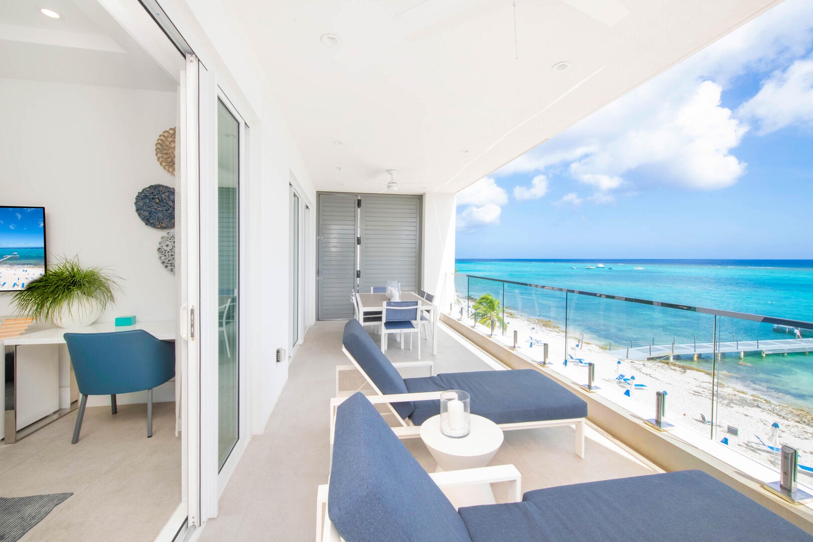 Walkout access from the primary suite onto the ocean balcony.