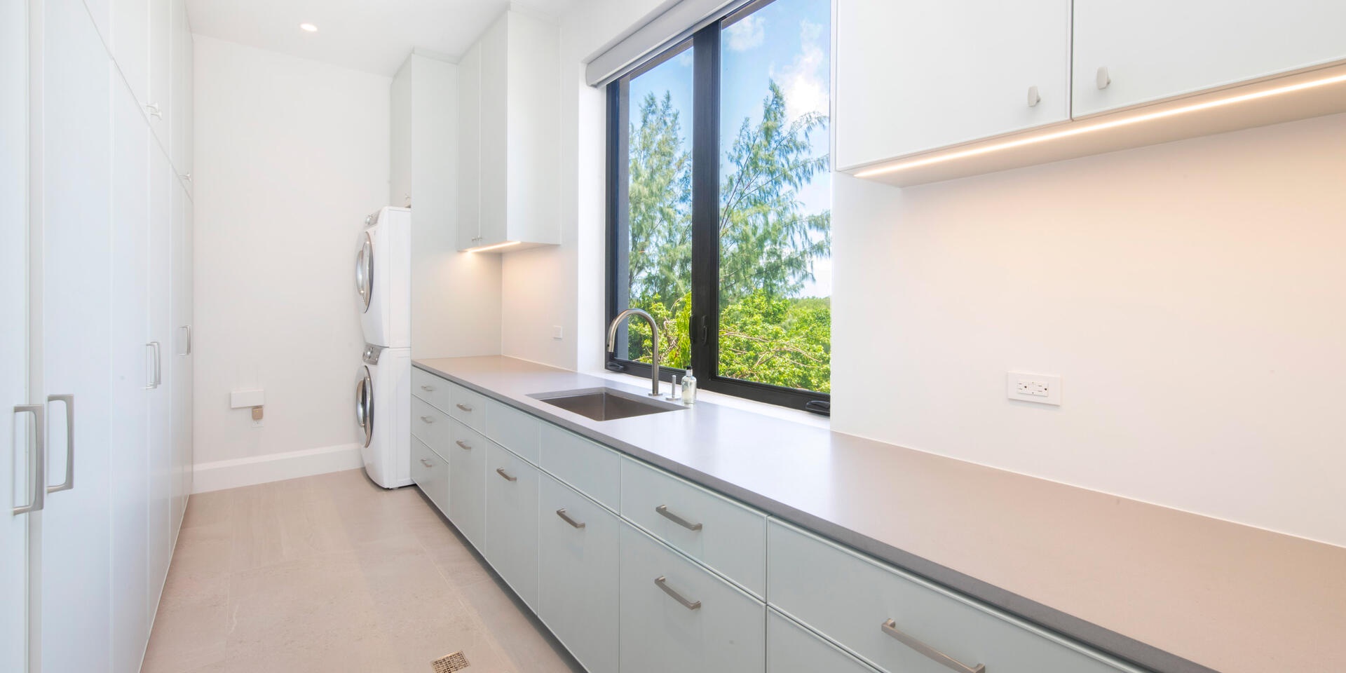 The main villa's laundry room with washer and dryer.