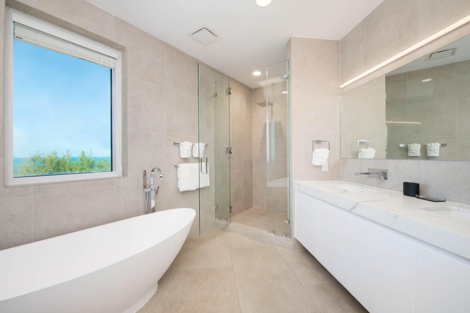 Primary Ensuite #1 with dual vanity, soaking tub, and separate shower.