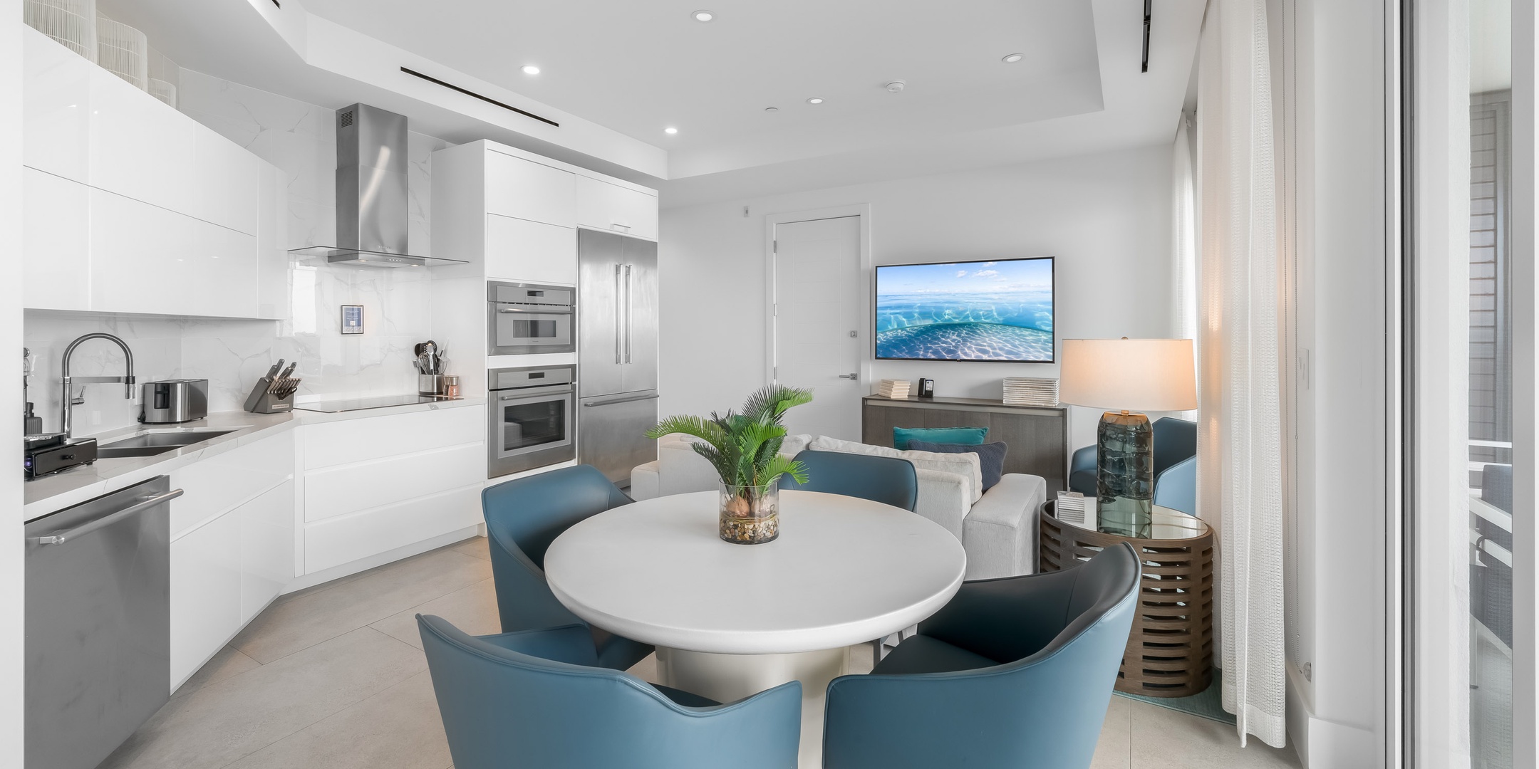 Dining, kitchen, and living areas.