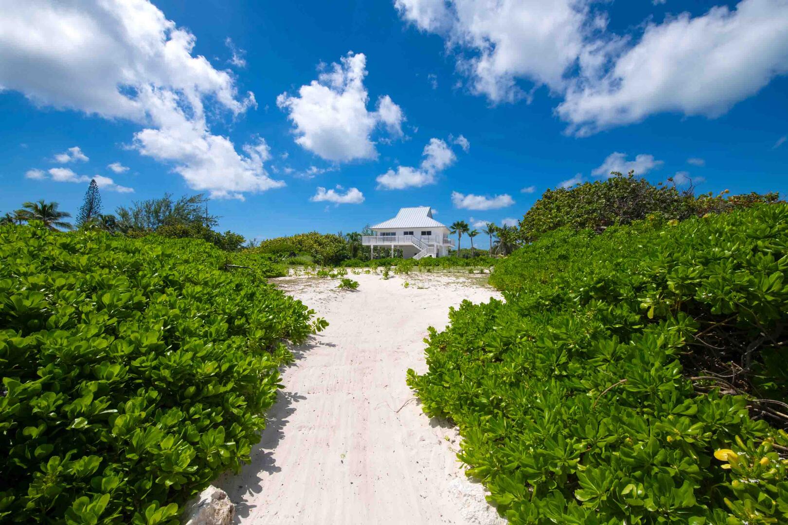 Sandy pathways from the home to the beach.