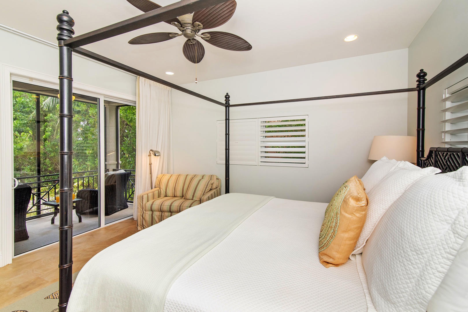 Lower North Suite with king bed and private screened patio.