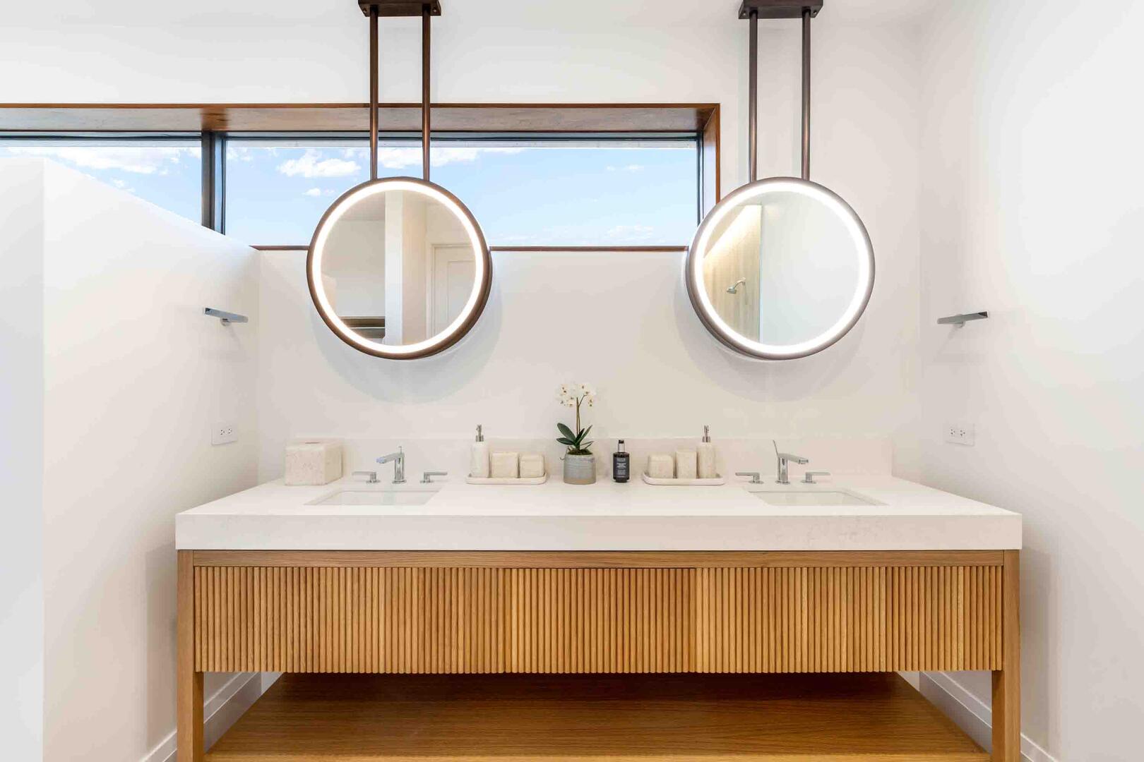 Primary Ensuite with dual vanity, soaking bathtub, and shower.