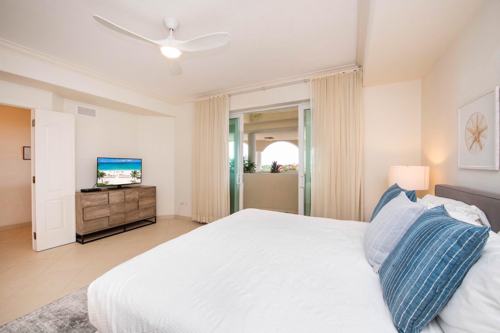 Primary suite with HD cable TV and king bed.