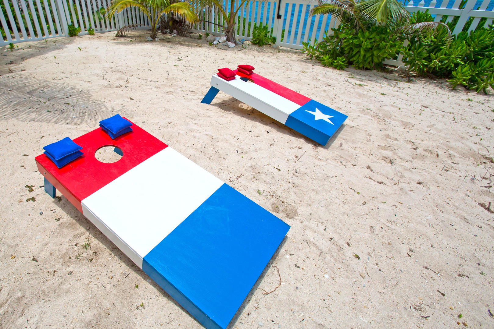 Play a game of cornhole by the pool area.