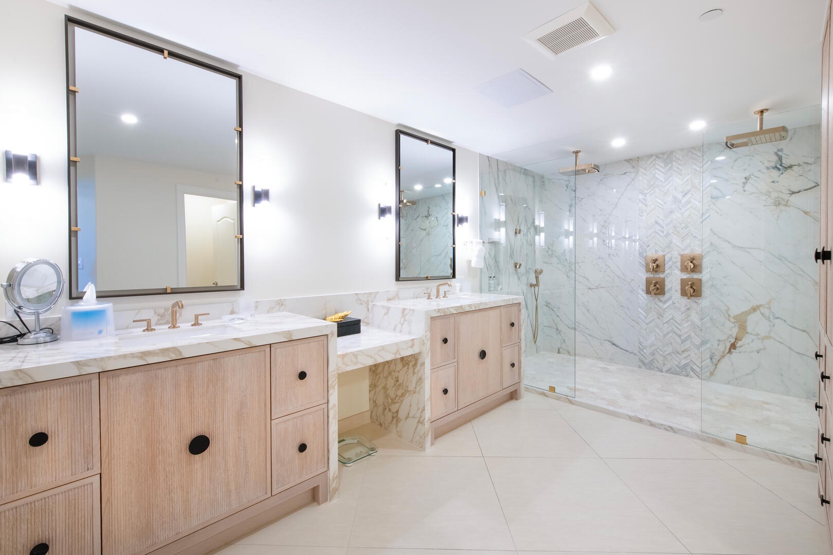 Primary ensuite with dual vanity and double rainfall shower.