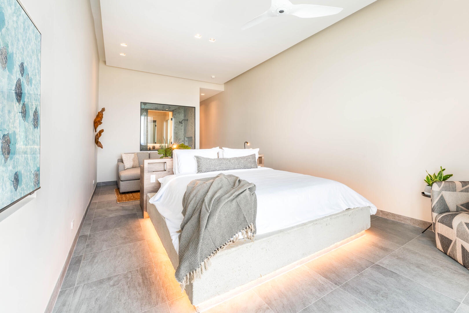 Oceanfront king suite 2 - king platform bed, desk, oceanfront floor-to-ceiling glass doors, 65" TV w/swivel mount, beverage fridge, coffee center, upholstered chair, sofa