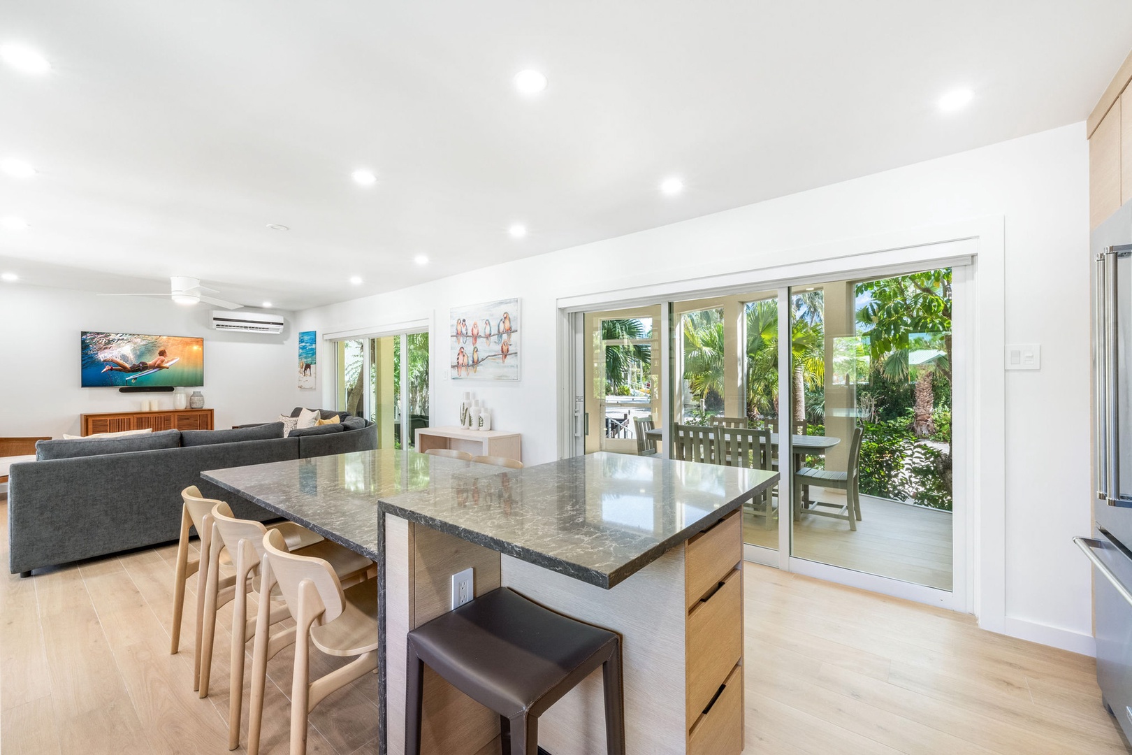 The lower level living areas feature walk-out access to the screened atrium.