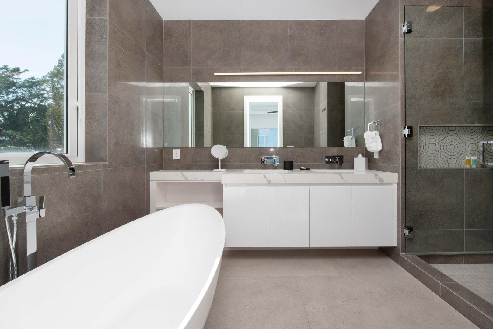 Primary Ensuite with oversized soaking tub, and walk-in shower.