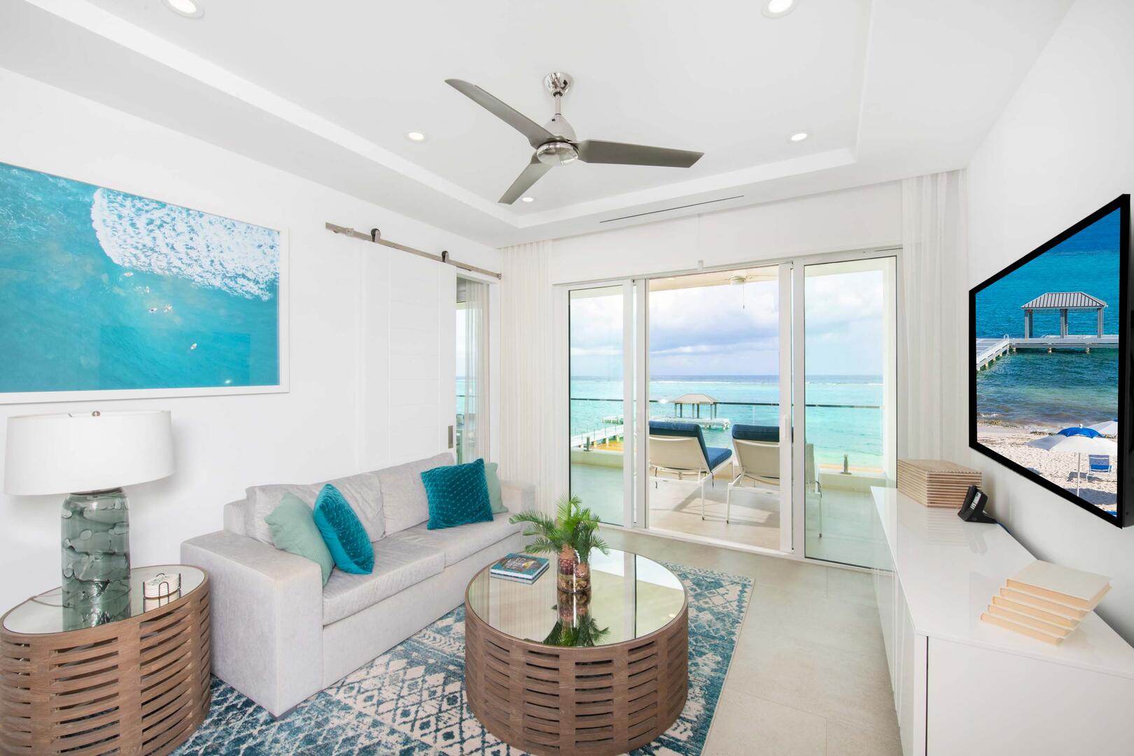 Living area with modern decor, a plush sofa, and SmartTV with high-speed wifi.