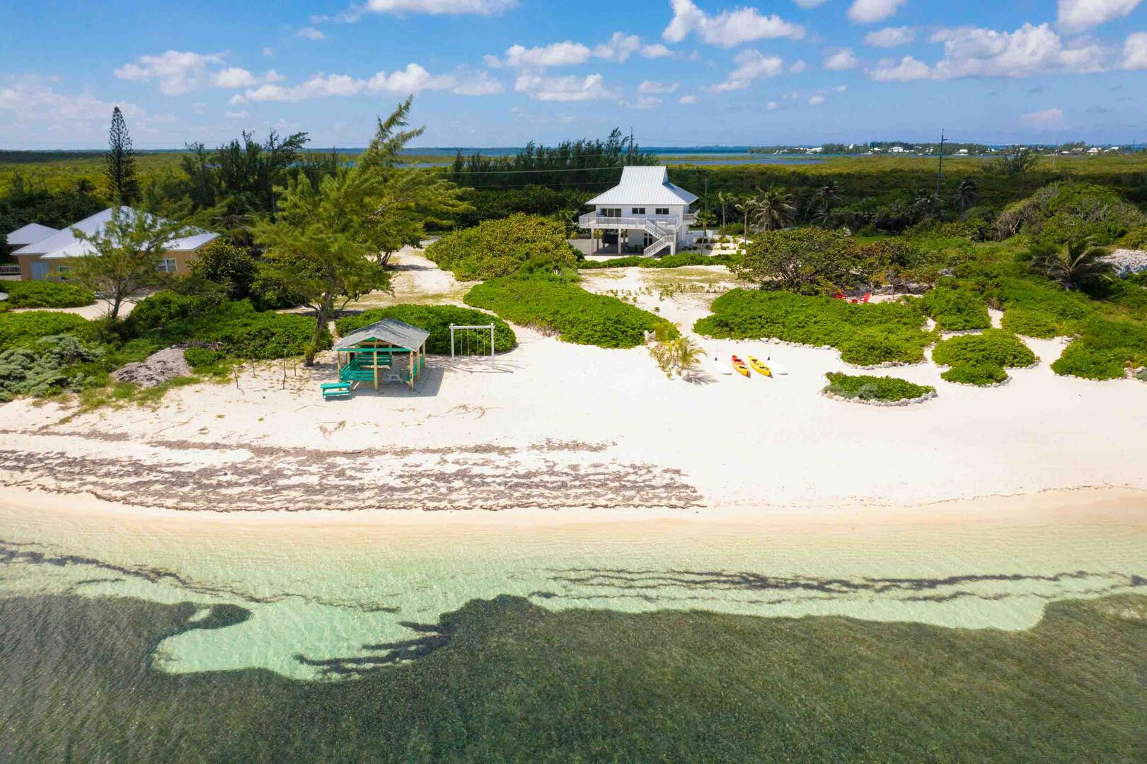 Aerial view of the villa and beachfront.