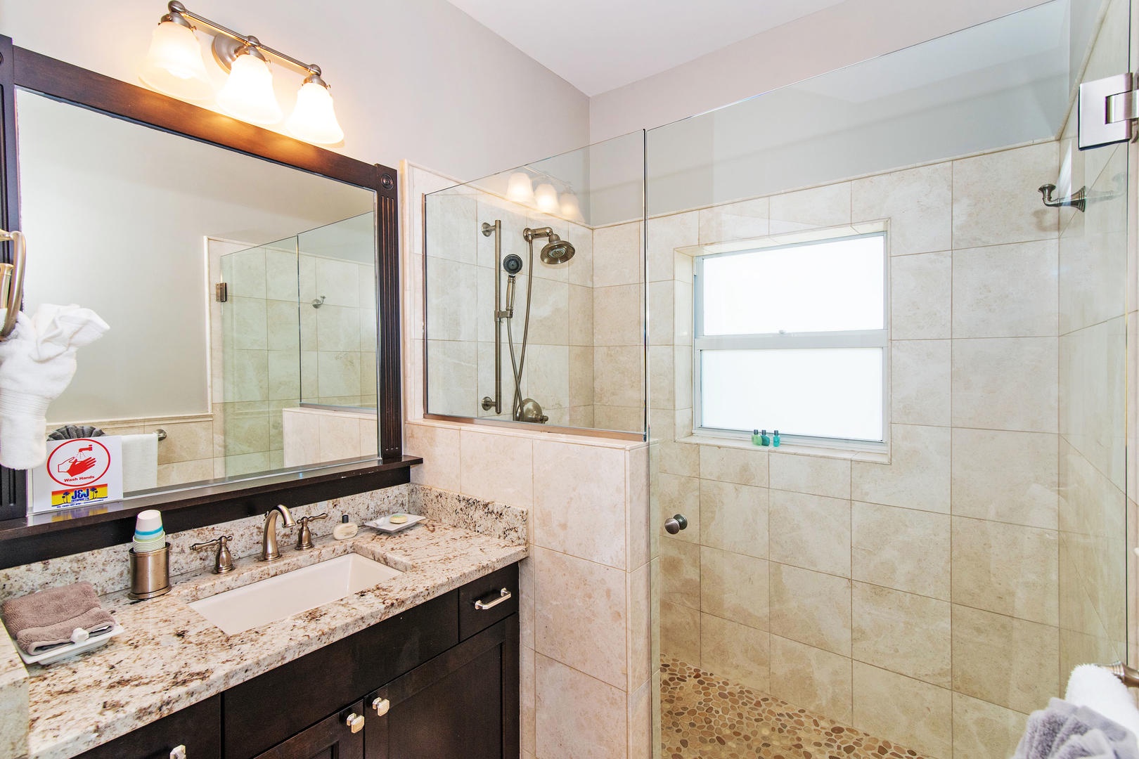 Upper South Suite bathroom with glass shower.