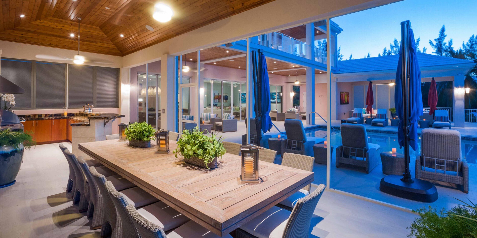 Outdoor kitchen with dining room table.