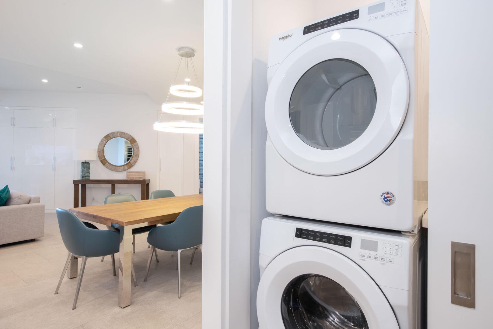 In-unit laundry room with washer and dryer.