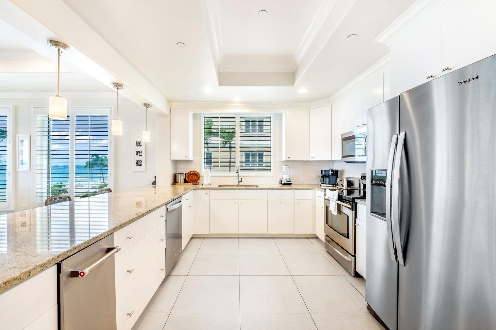Full kitchen with modern appliances. A blender, toaster, and Keurig coffee machine are provided.