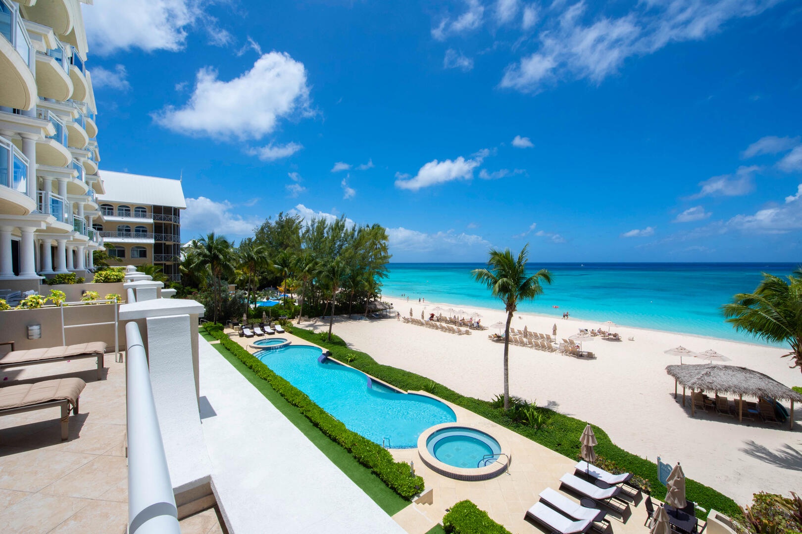 Balcony views of Seven Mile Beach. The resort's pool, heated spas, and beach service is reserved exclusively for guests.