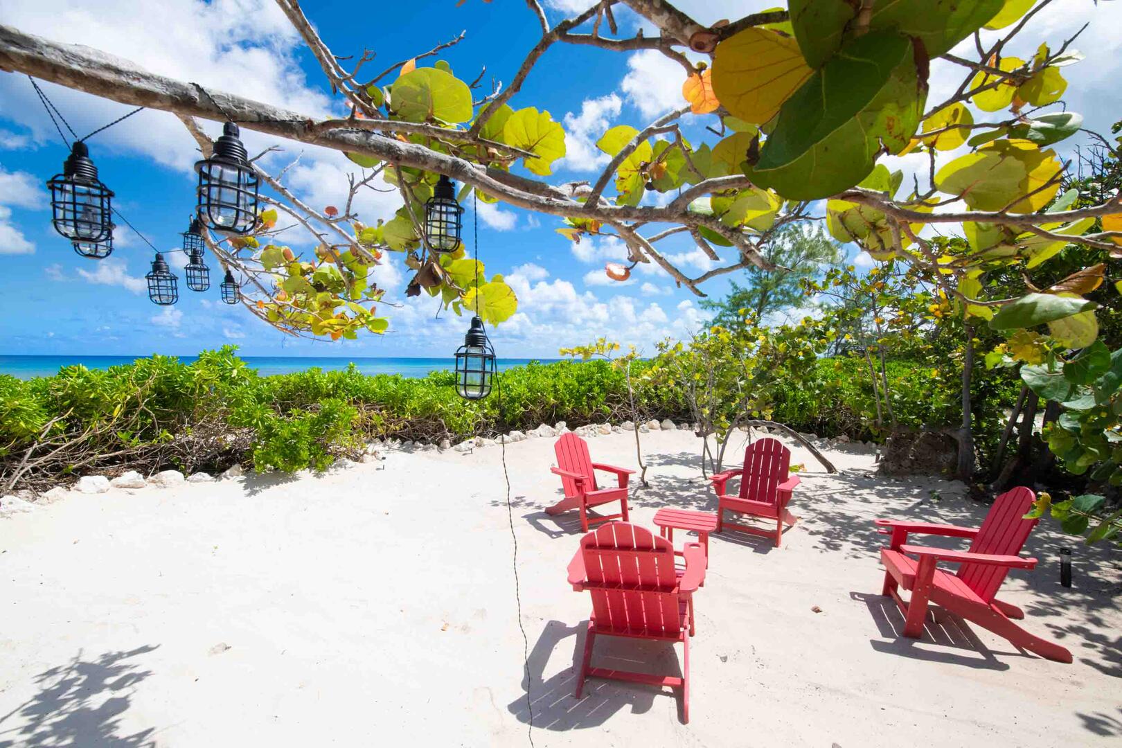 Secluded beach lounge with Adirondack chairs for late night hangs.