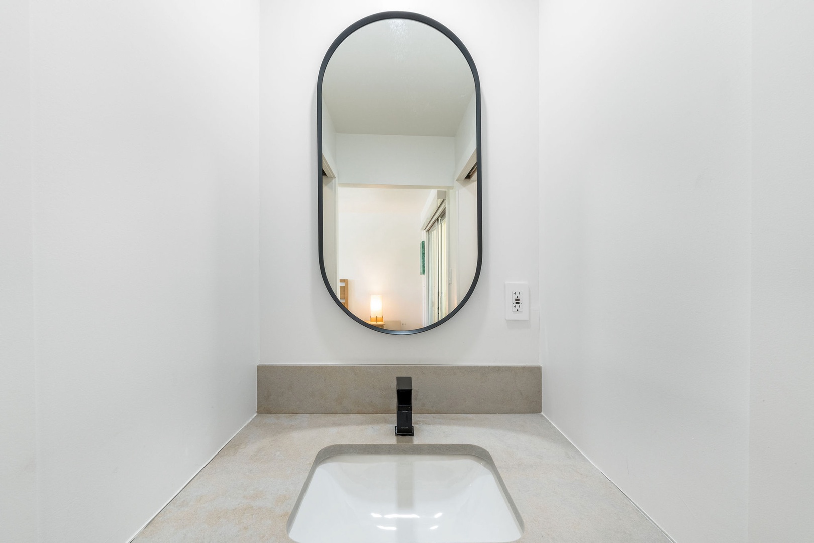 Lower-level powder room.