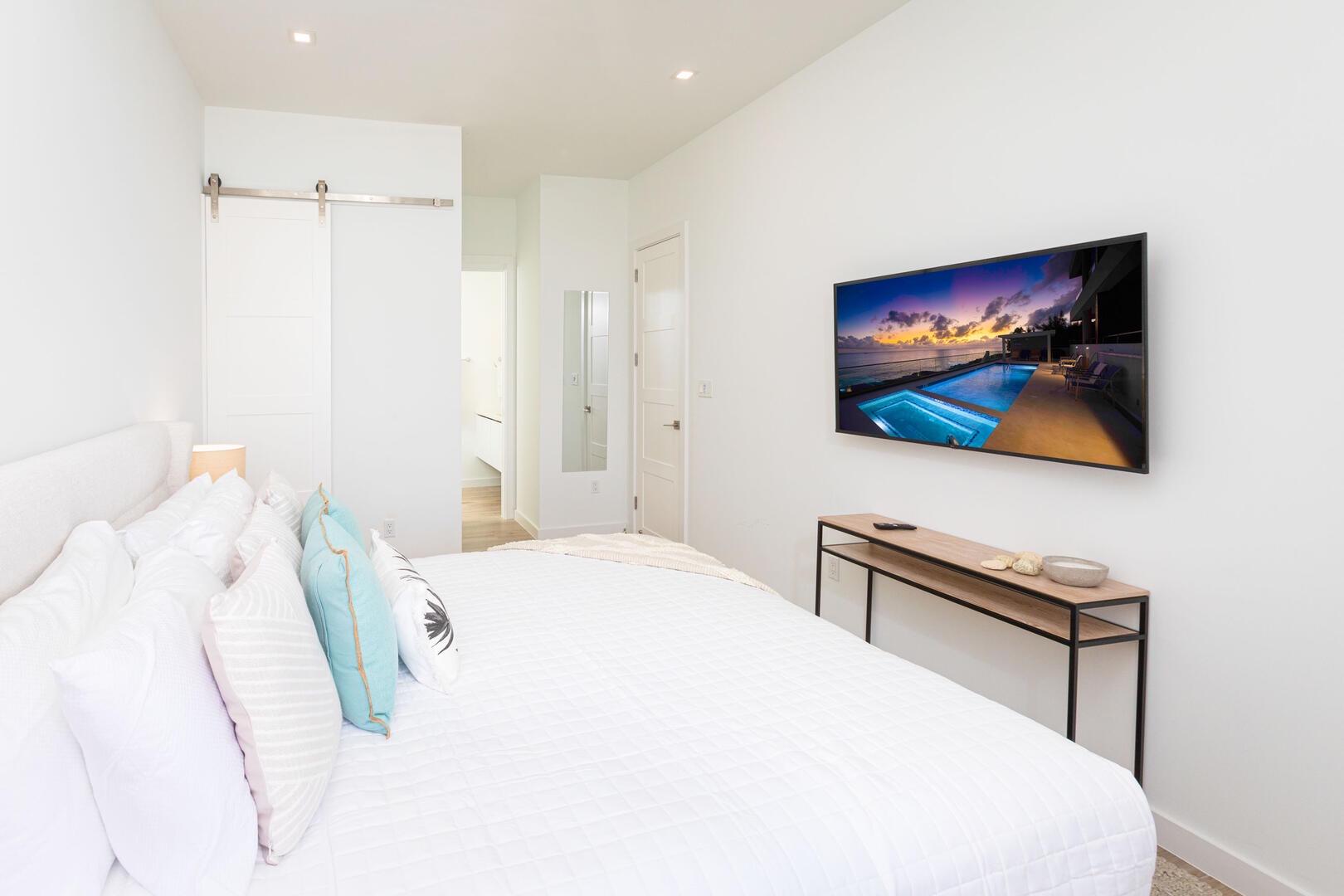 Queen Suite with queen bed and television.
