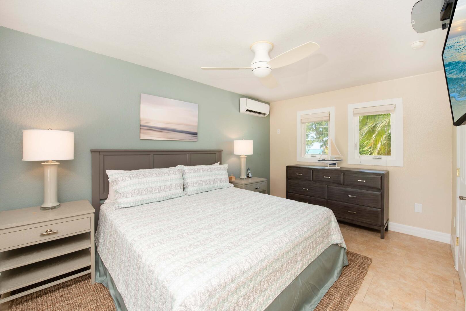 Primary Suite with king bed, television, and remote controlled air conditioner.