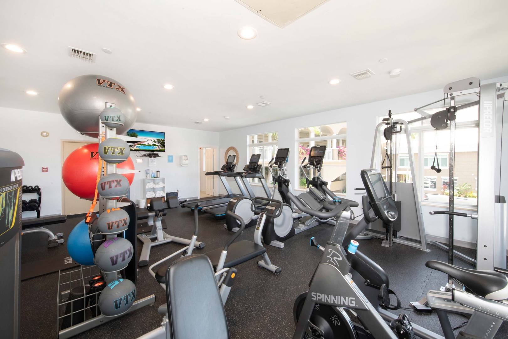 The 2nd floor gym is equipped with cardio machines and free weights.