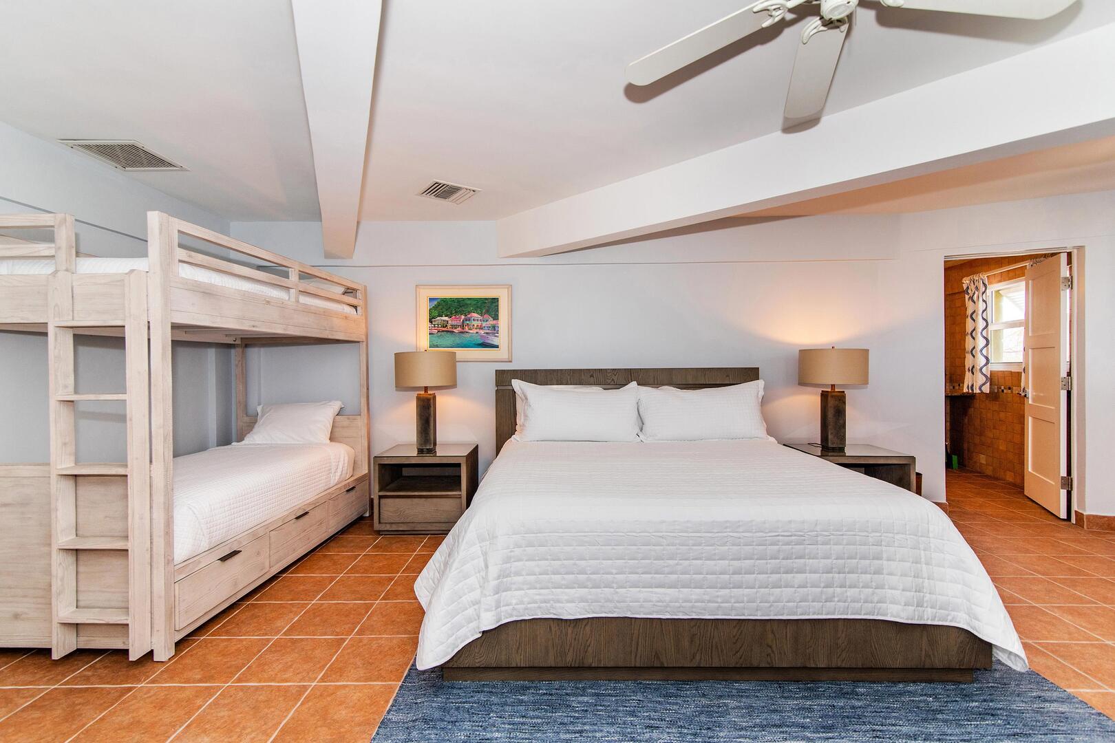 Family suite on the main level with king bed and a set of bunks for kids.