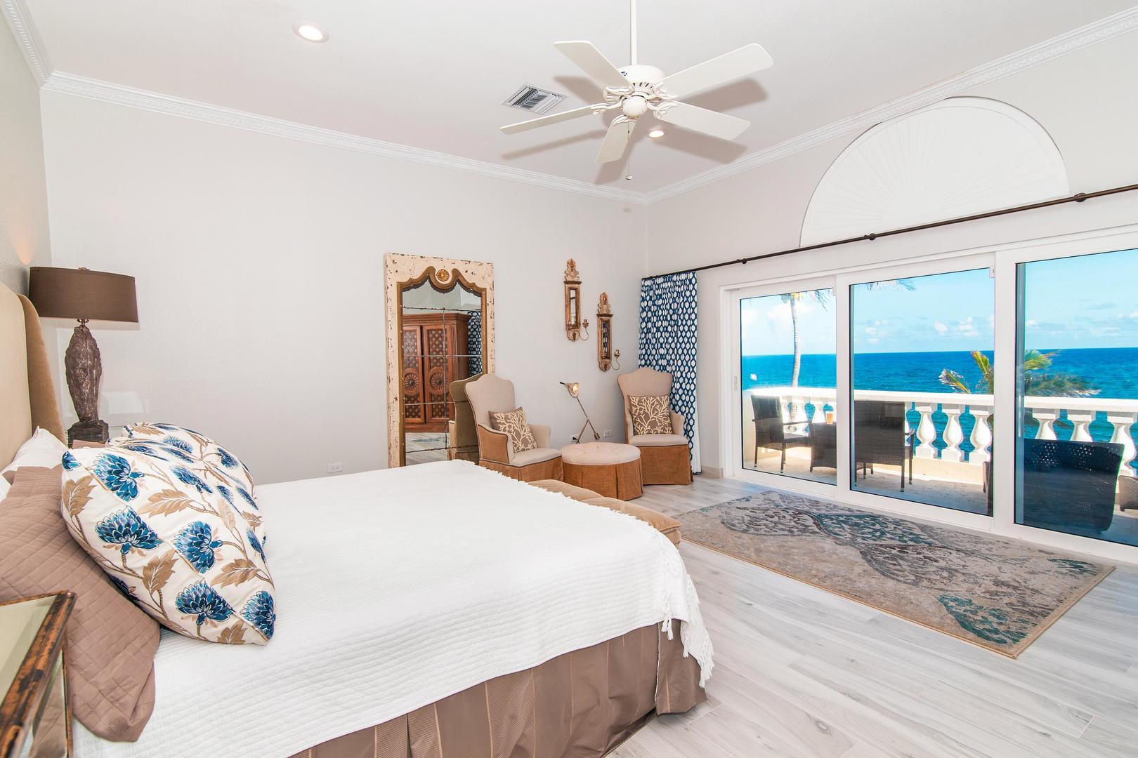 Primary Suite with oceanfront views and a private furnished balcony.