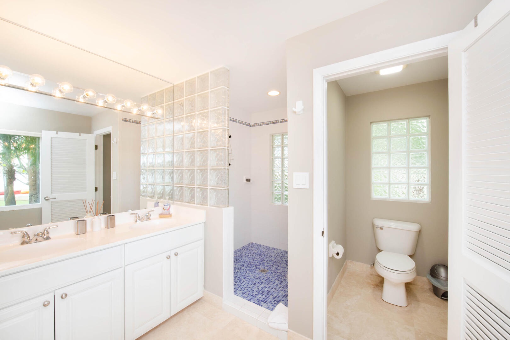 Lower Ensuite with dual vanity, large shower and water closet.