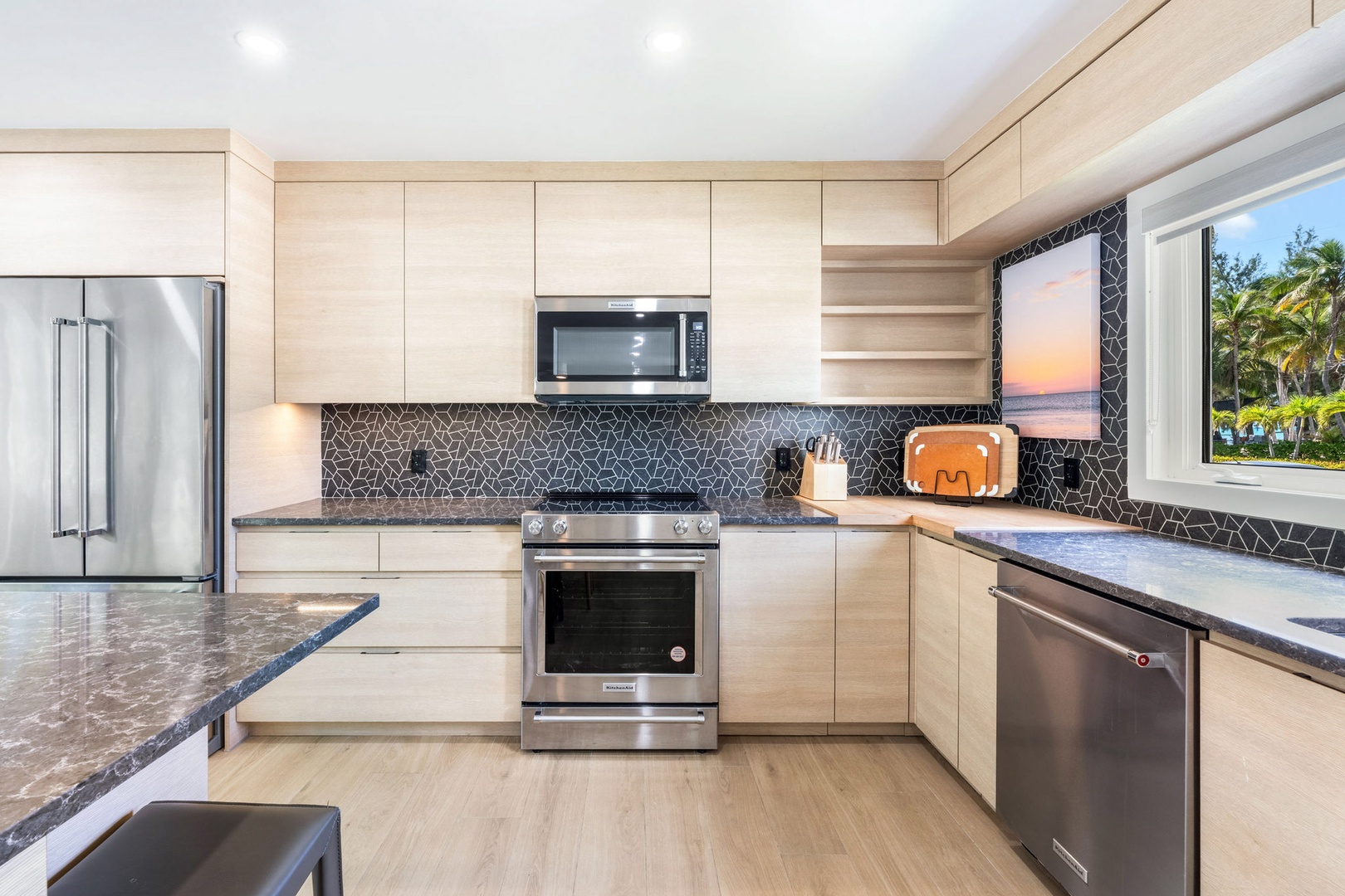 Full kitchen with modern appliances.