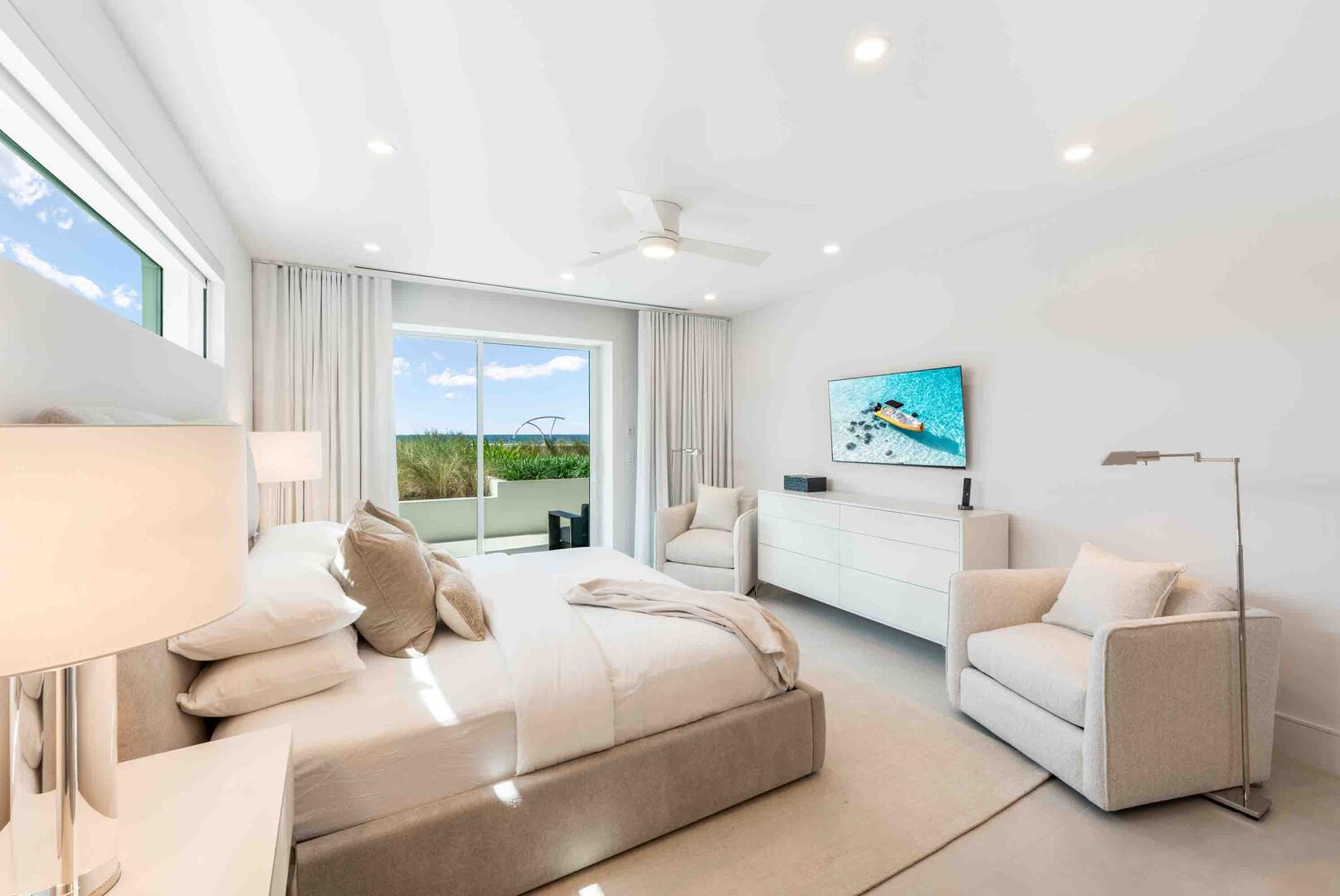 Bedroom 1 is the primary suite and comes furnished with a king bed, HD SmartTV, plus walkout access to the terrace.